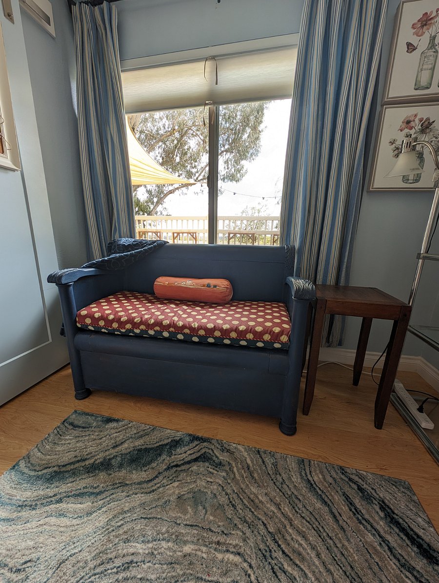 Bench provides extra storage and and comfortable place to sit