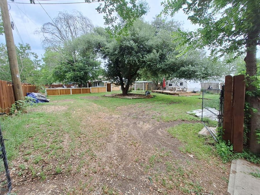 RV and Truck located at the back corner is locked and owned by owner for storage.  You will not have access to these items however, you can use deck, tables and umbrella for your enjoyment.  The owner will not be on premise.    