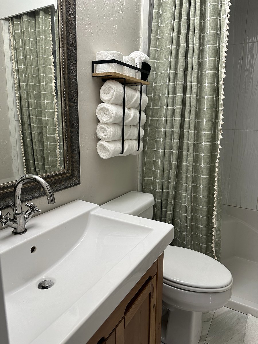 Master Bath with walk-in shower, hand held sprayer and bench.  Walk-in closet attached to bath. 
