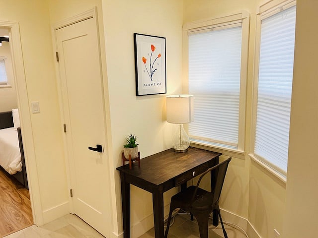 Work space with desk and additional outlets for laptop.