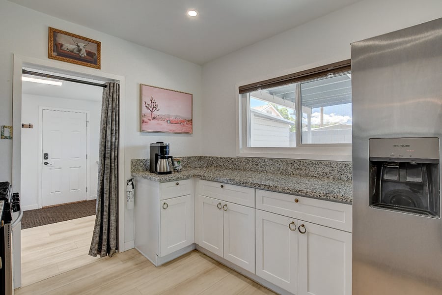 Main Home's galley kitchen with wide walkway for more than one cook in the kitchen