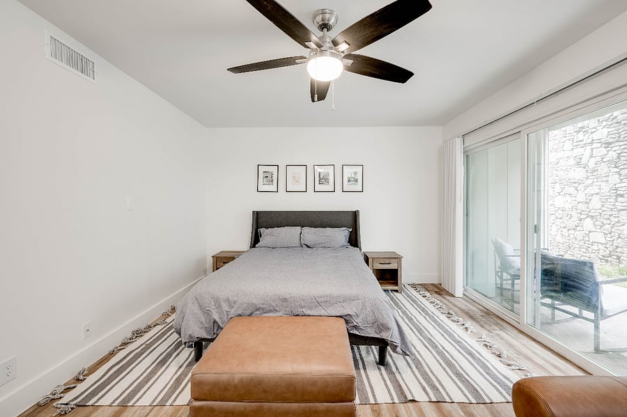 Bedroom opens to small patio. Larger, public seating areas along the river