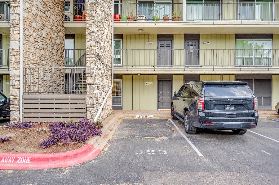 Reserved parking spot in front of apartment