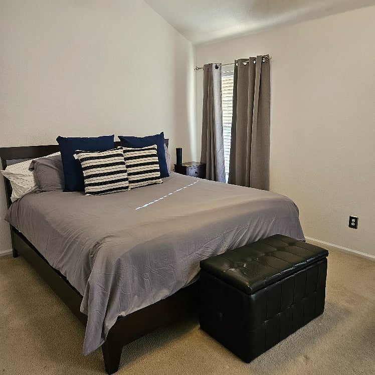 Master bedroom with King bed, walk-in closet and black out drapes