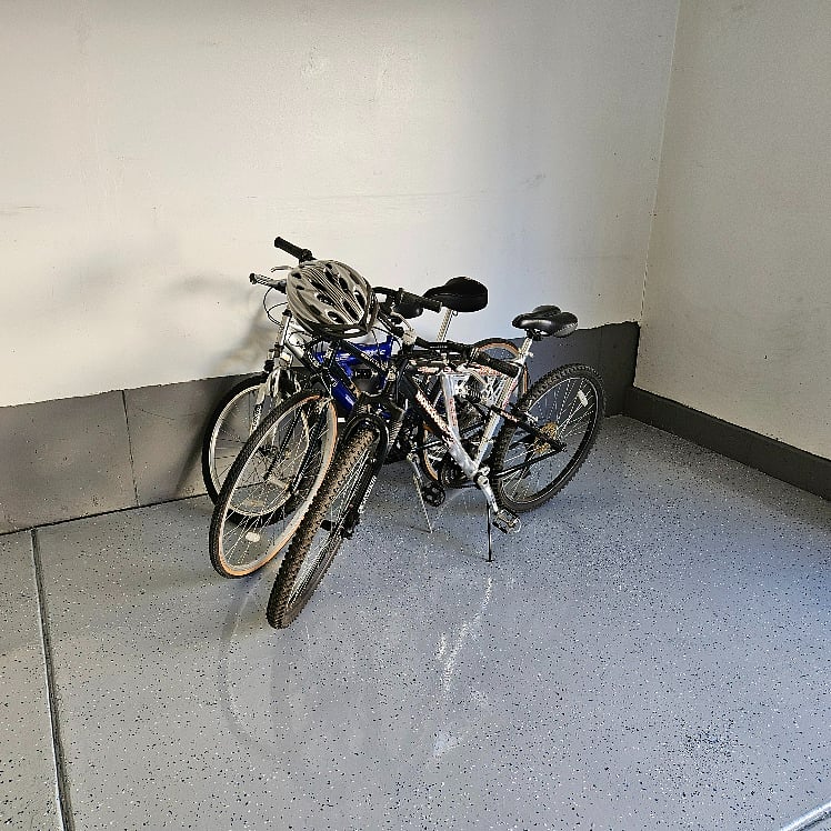 3 Bicycles with helmets