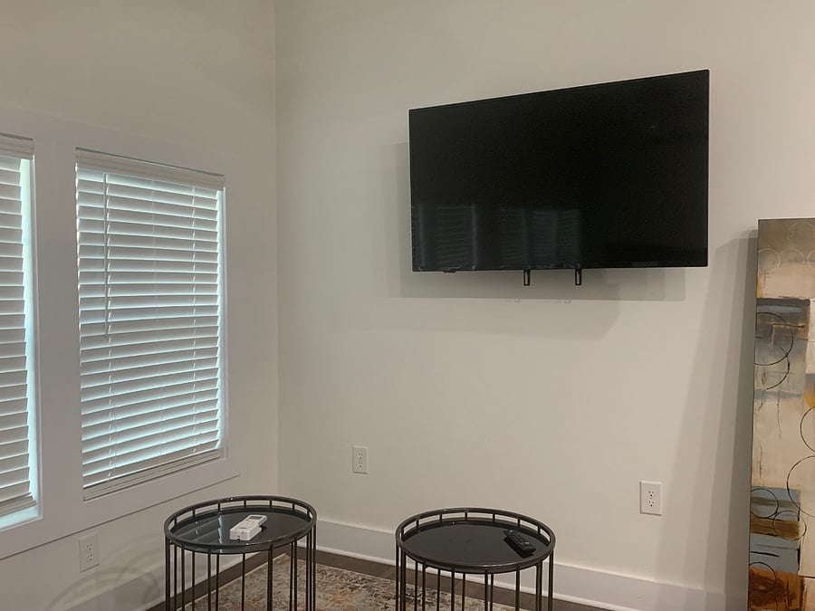 View of TV from the bed area and couch.