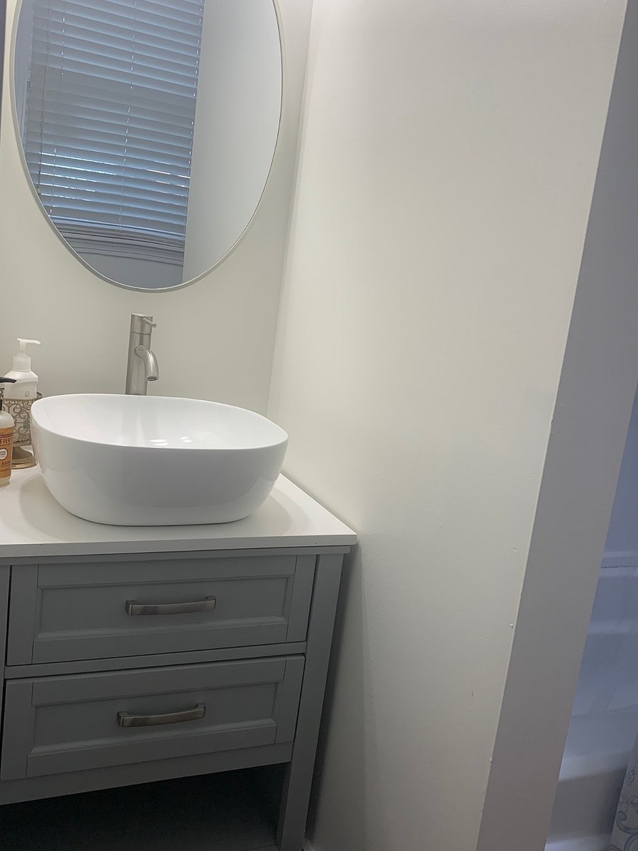 Bathroom sink area with storage for products and other bathroom essentials.