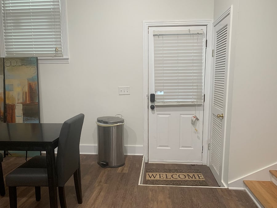 View of private front door entry way. This entrance is only used by the tenant. (note: the other door is the water heater closet)