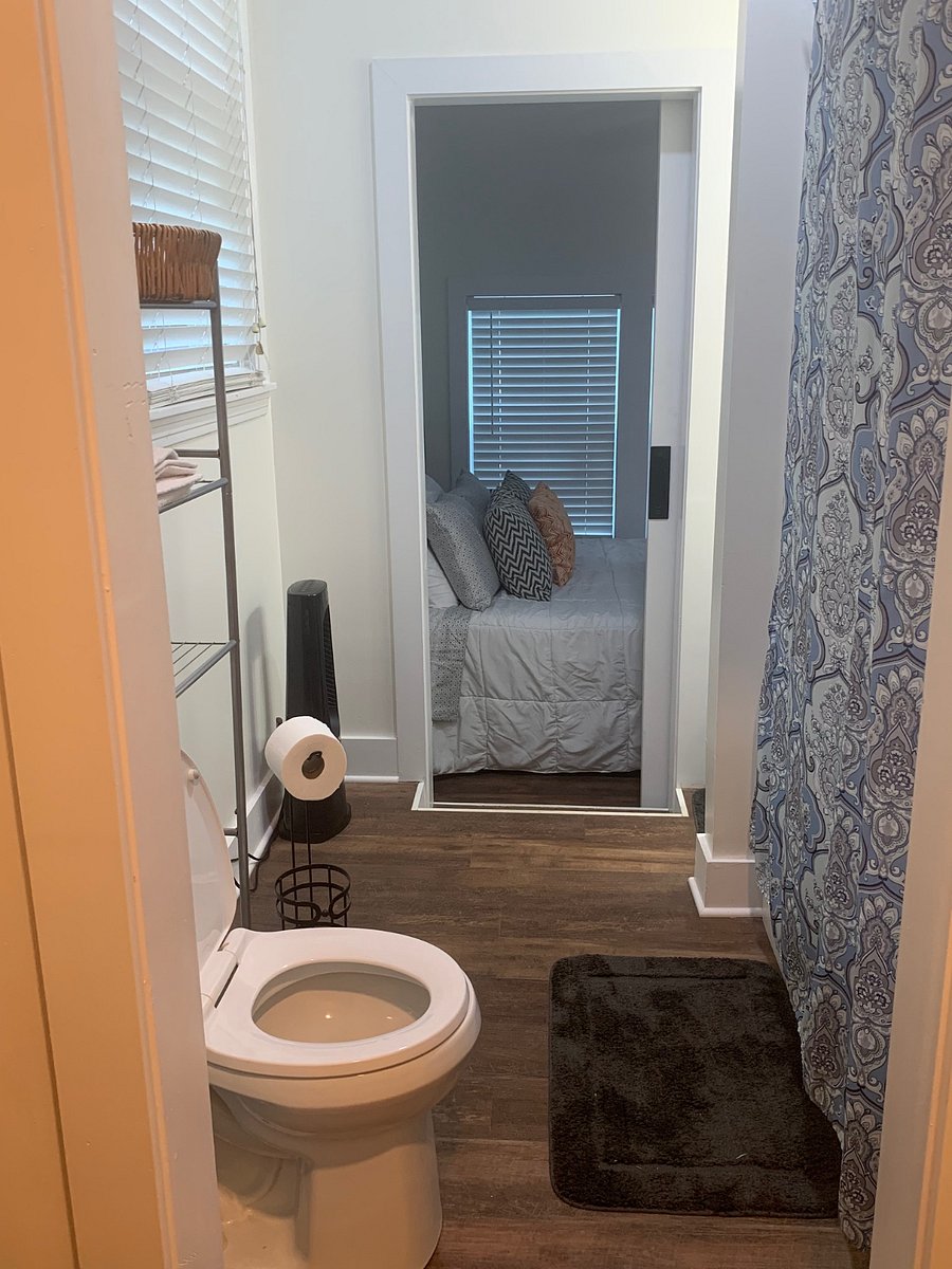 View from closet looking into bathroom and bedroom area.