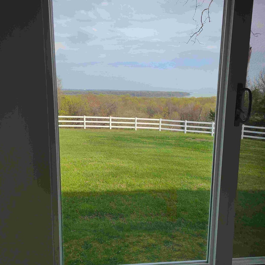 River view through siding doors in porch