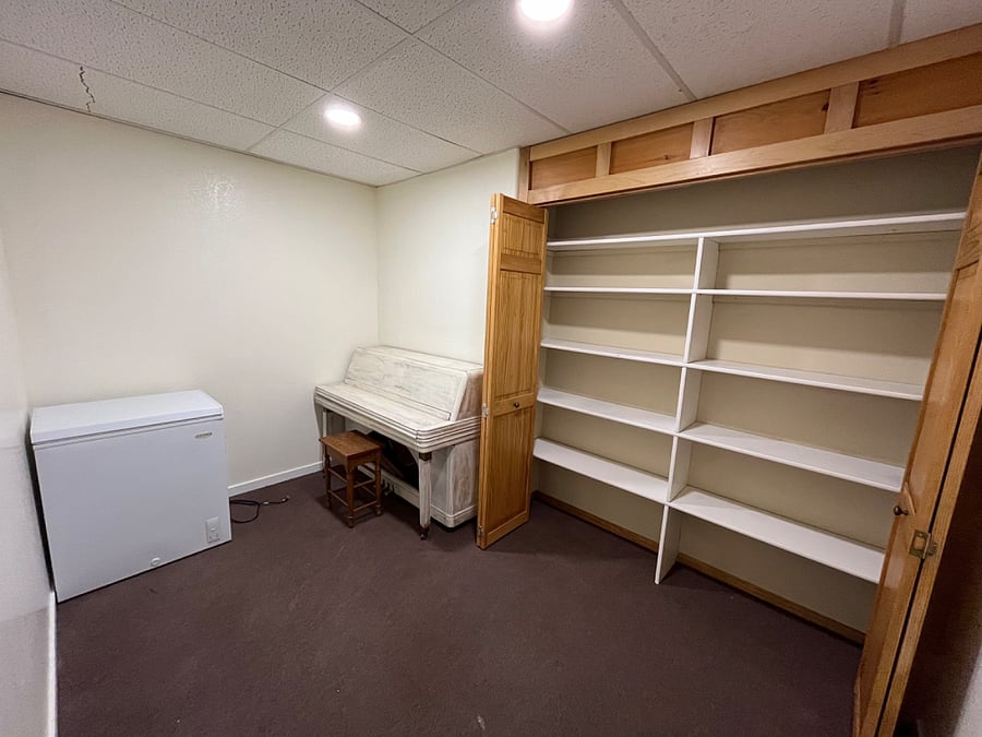 extra storage room for tenant's recreational equipment, deep freezer, storage shelves. The piano does work for those who play.