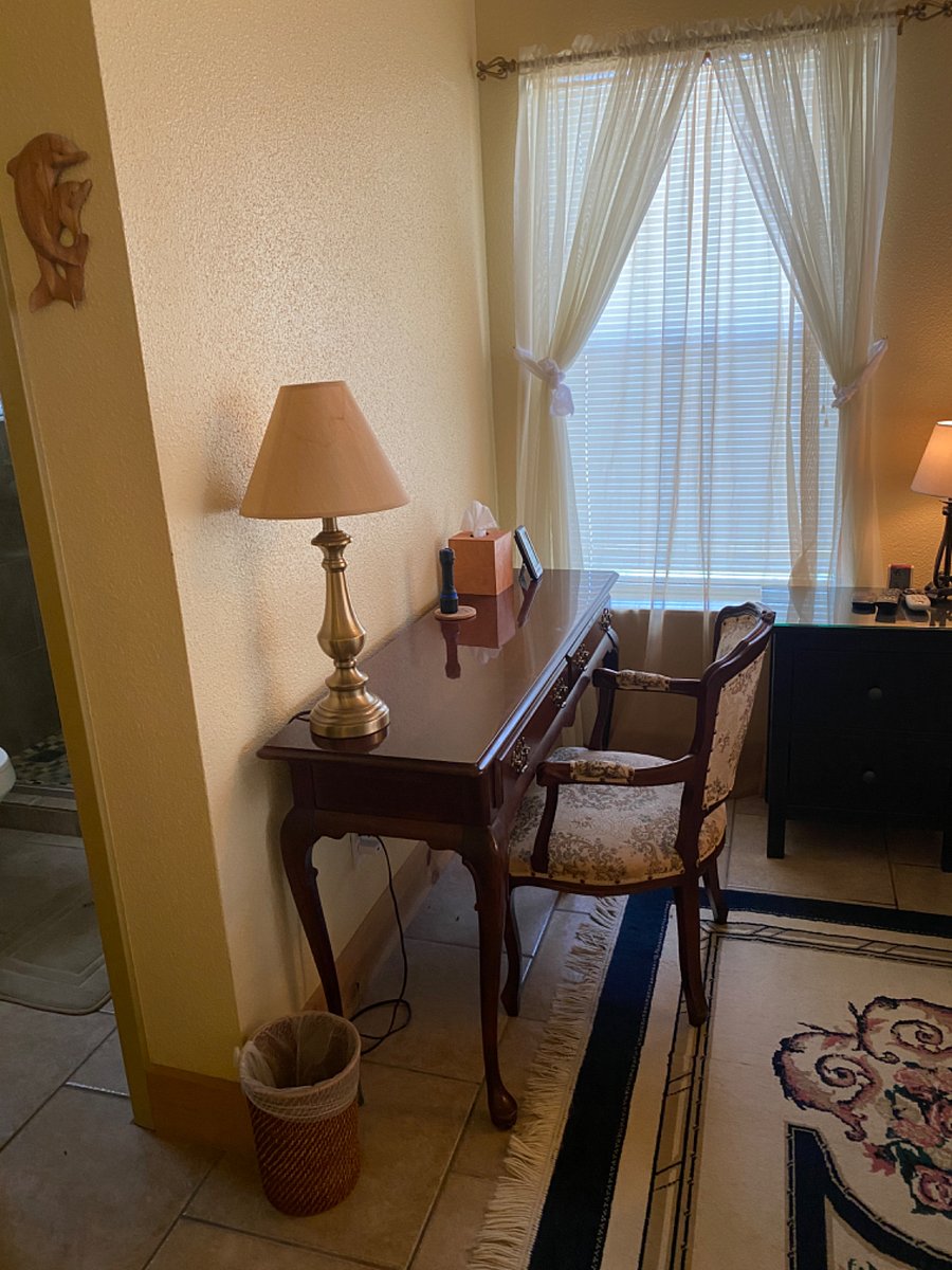 Bedroom One has a workspace area, large screen TV and door the access outdoor patio.  En suite bathroom.