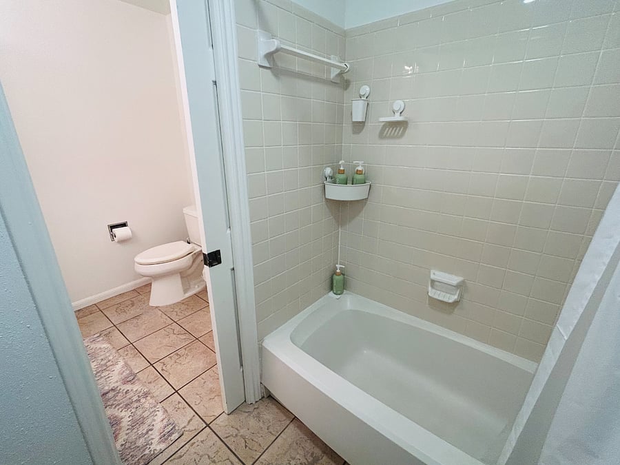 View from Tub/Shower towards Commode/Wash Basin