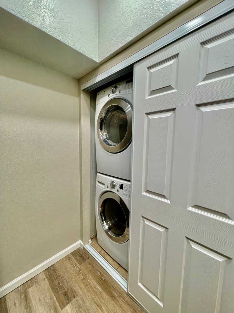 Laundry Area with Stacked Washer & Dryer. 