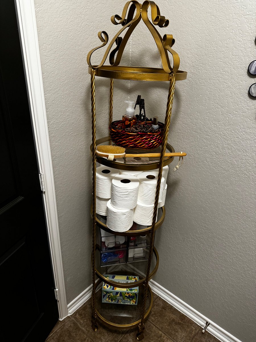Bathroom rack with ample toiletries & body brush, Tylenol, & advil. 