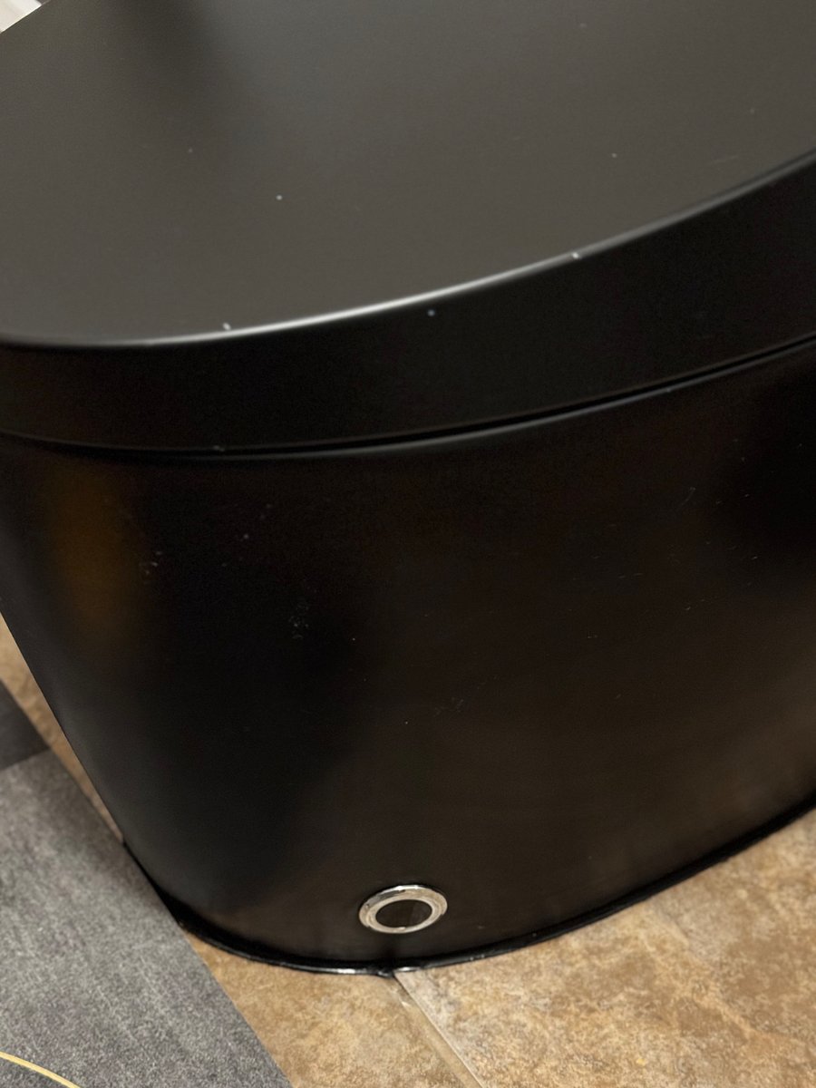 Sensor button to the right bottom of the toilet is for our male guests, it will lift the toilet seat & return down, simply by placing your foot near it. 