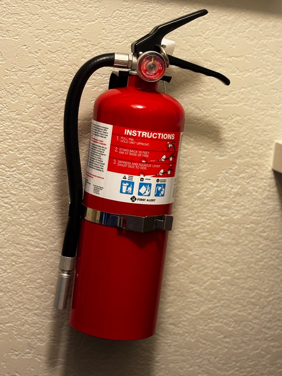Fire extinguisher is located in the Laundry area to the left. 