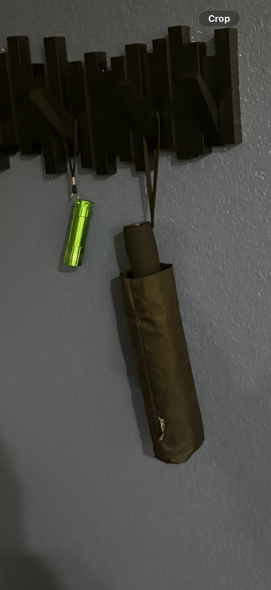 Umbrella & flash light kept on coat hanger