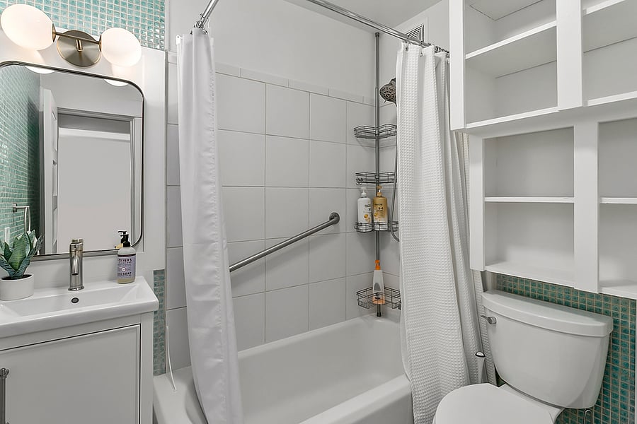 Shower/bath tub combo equipped with "straight grab bar" & dual shower head; one mounted and one handheld.
Shampoo, conditioner, body wash, hand soap & hair dryer included.