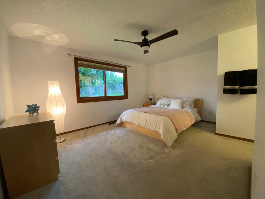 Peaceful Primary Bedroom includes an en-suite bathroom.  Window blinds are high quality up-down/down-up blackout shades. Ceiling fan as well.