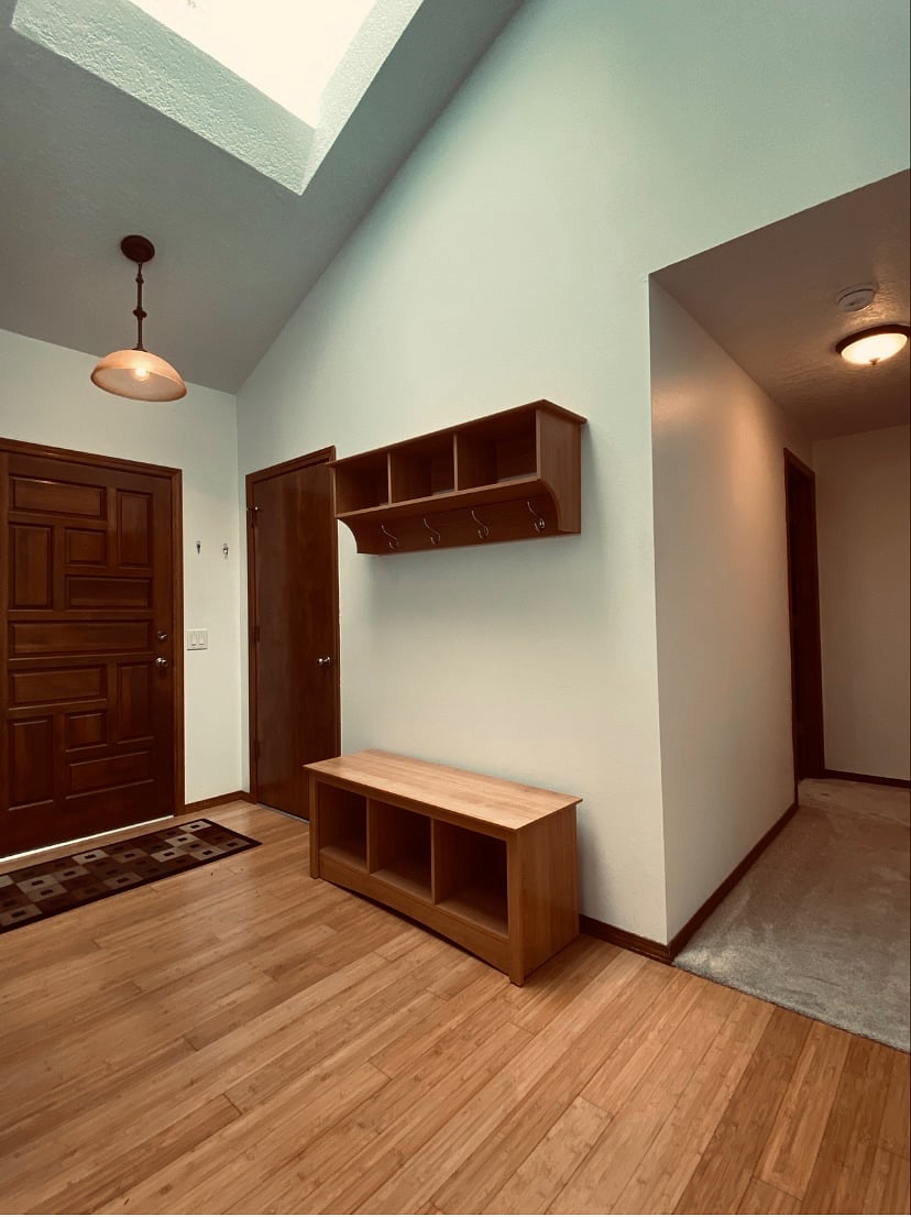 Entry is bathed in light from the large overhead skylight.
