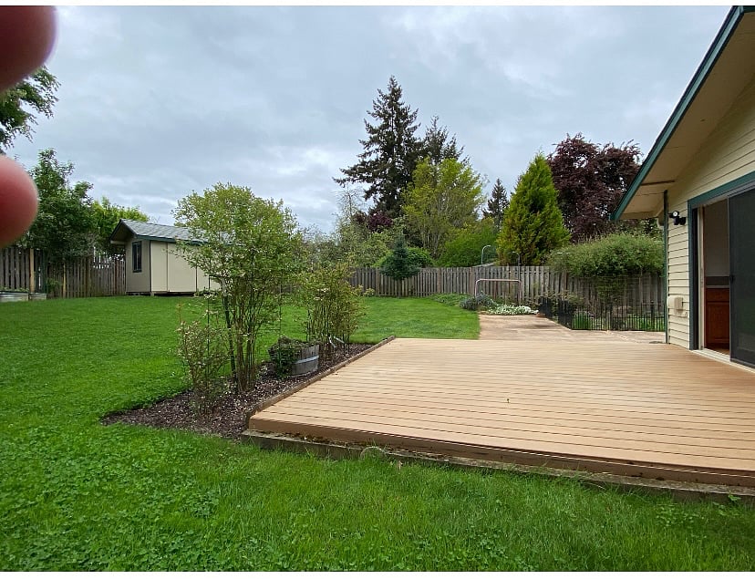 Ample back yard - great for enjoying the outdoors.  Patio furniture not shown (will update photo soon).  Blueberry bushes just off the deck and strawberries in the garden - feel free to pick some if you're at the house when they ripen!