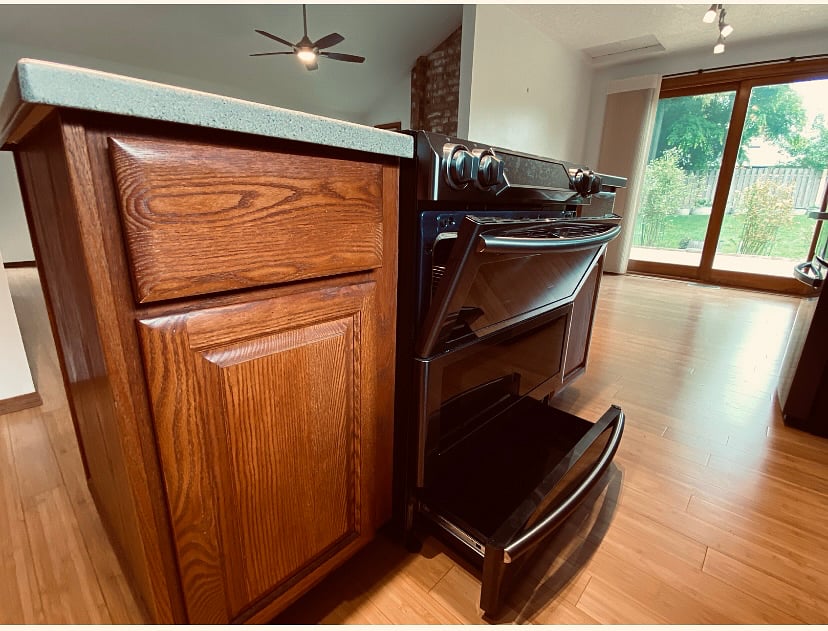 High end induction stove and oven.  Oven has a upper small oven and a larger regular size oven.
