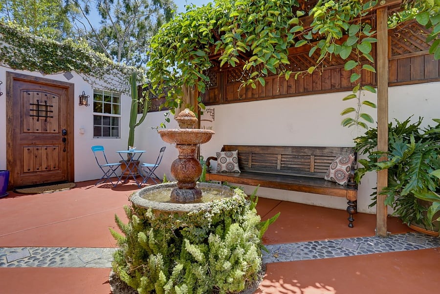 Shaded courtyard seating and outdoor dining under the pergola