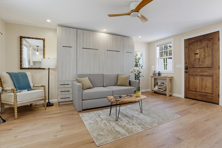 Comfortable living area with a queen murphy bed pull down