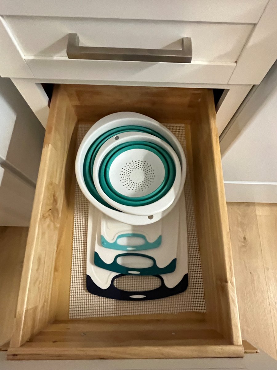 Various cutting boards and strainers.