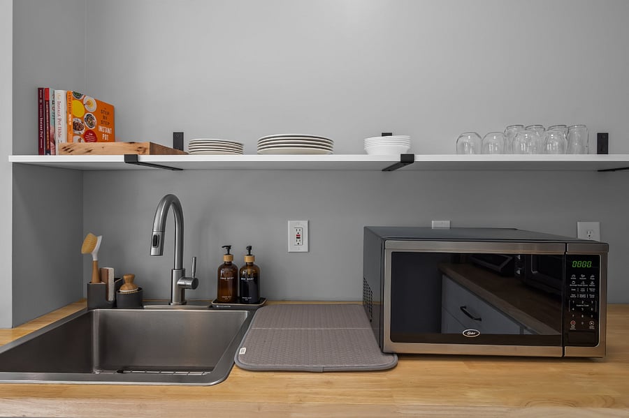 A nice deep sink is perfect for washing up any dishes as needed. The microwave is great for quick meals!