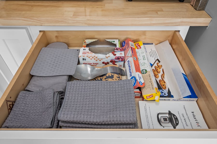 Kitchen linens, oven mitts & hot pads/trivets, and basic kitchen items like aluminum foil, plastic wrap, sandwich bags, etc are typically on hand.