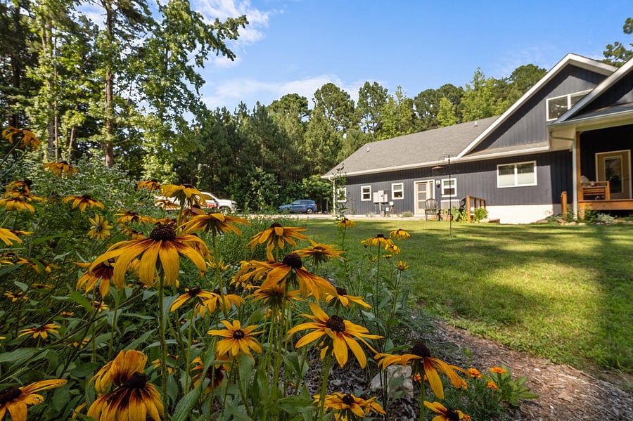 There are lots of flowers & landscaping around the house!