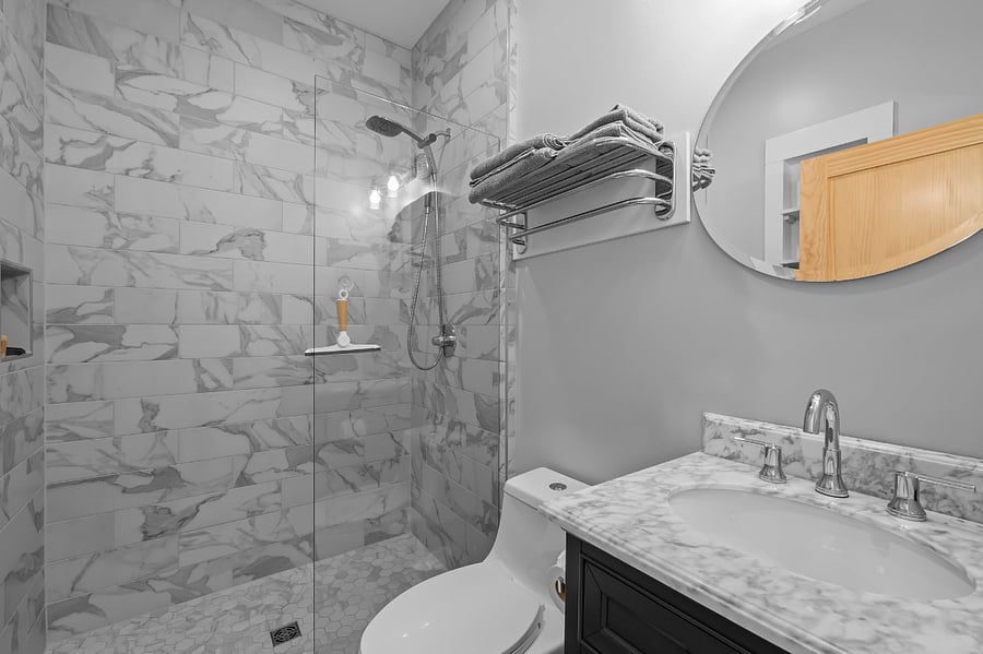Zero-entry (curbless) shower makes accessibility easier. Towel & wash cloth storage & hanging capabilities.