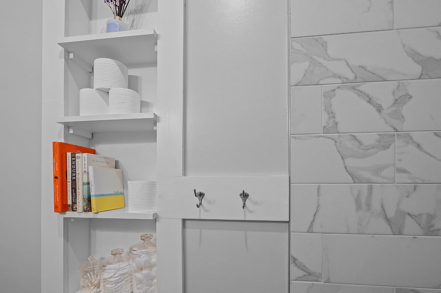 Built-in storage - TP, books, hooks for towels, etc!