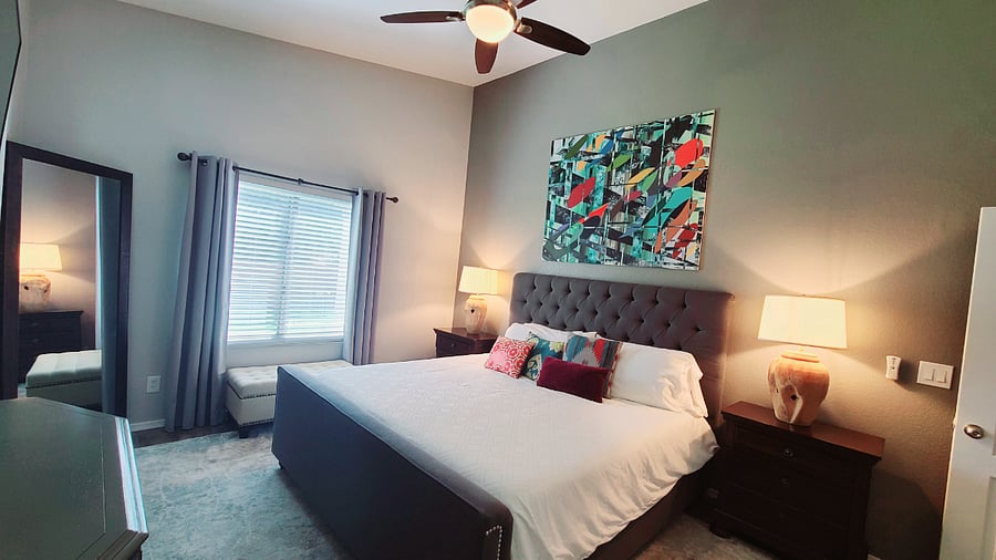 Immerse yourself in our Peaceful Prime master bedroom, where we've curated a collection of our favorite art pieces to infuse vibrant splashes of color into the decor. It's a blend of comfort and artistic expression for a truly unique retreat.