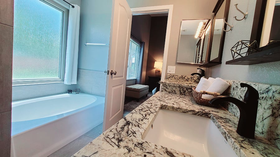 Indulge in relaxation in our Prime Bedroom ensuite bathroom, featuring a wonderful garden tub with privacy glass. It's the perfect spot to take a soak while enjoying the warmth of the Arizona sun, creating a serene and private retreat.