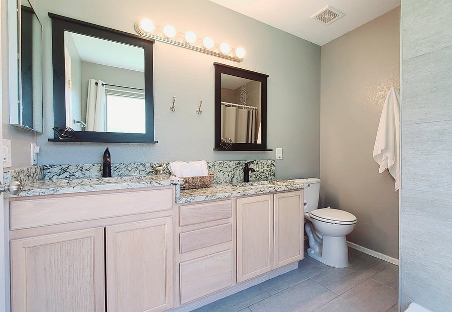 Experience convenience in our Peaceful Prime Bedroom ensuite bathroom, equipped with dual sinks at different heights for your comfort. It's a thoughtful touch to enhance your stay with us.