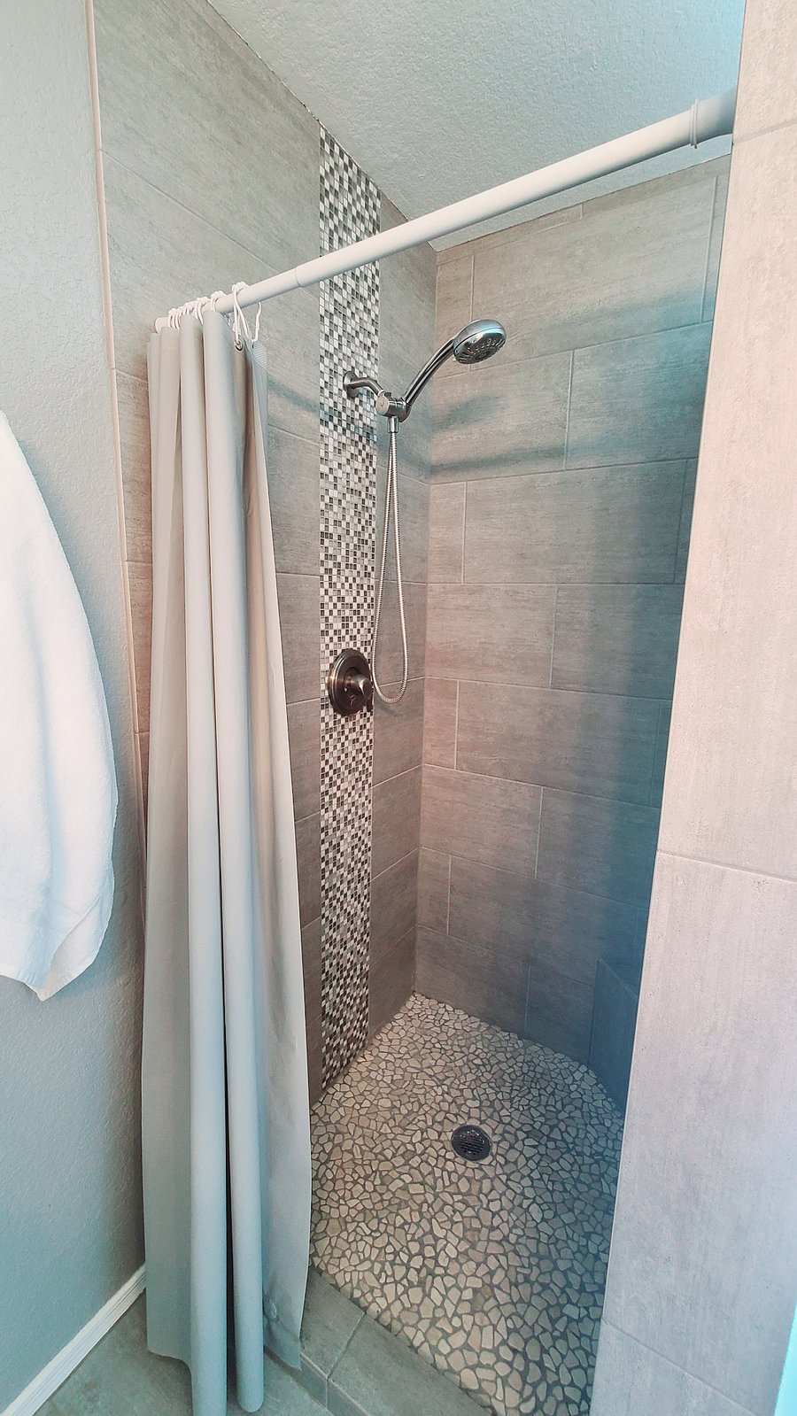 Relish the luxury of our Peaceful Prime ensuite bathroom, featuring a spacious walk-in shower. It's a sleek and inviting space designed for your comfort and convenience.