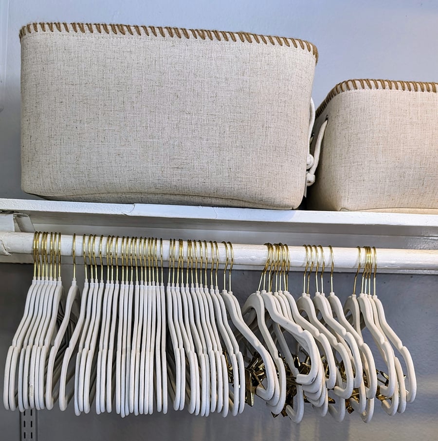 Velvet hangers. Storage baskets.