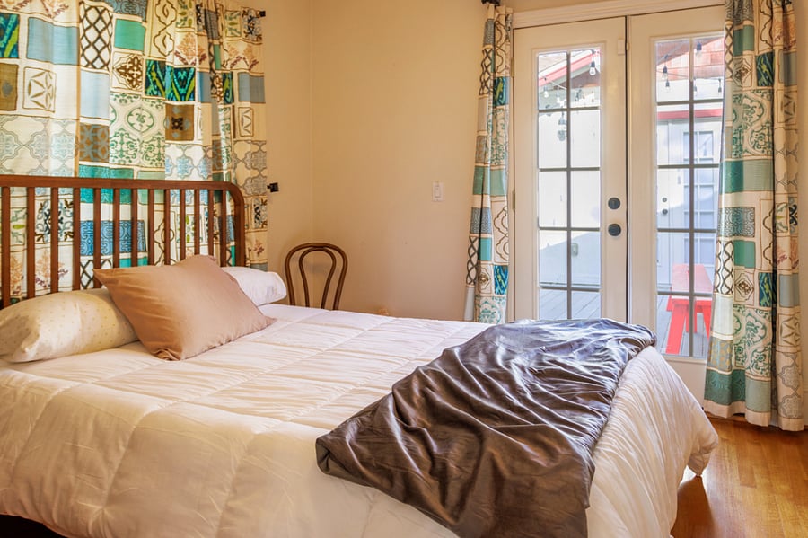 Guest bedroom Queen Bed + Patio Doors