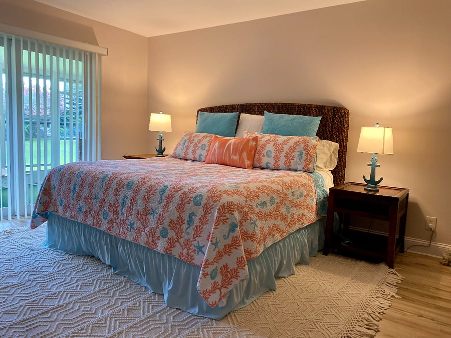 Master bedroom with king bed and sliders to the lanai