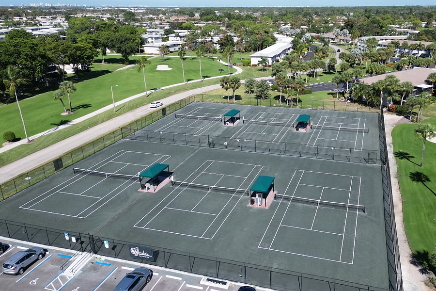 6 HarTru tennis courts with covered areas and water/ice station
