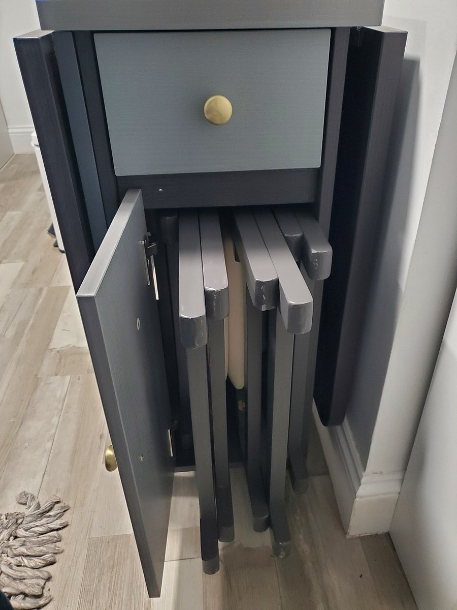 Table comes with 4 chairs stored on the sides. Drawer has silverware.