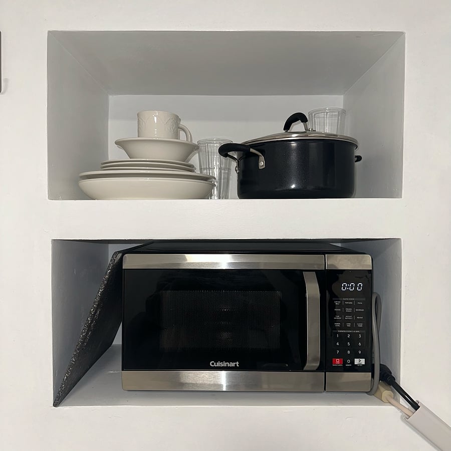Microwave and Storage for Dishes.
