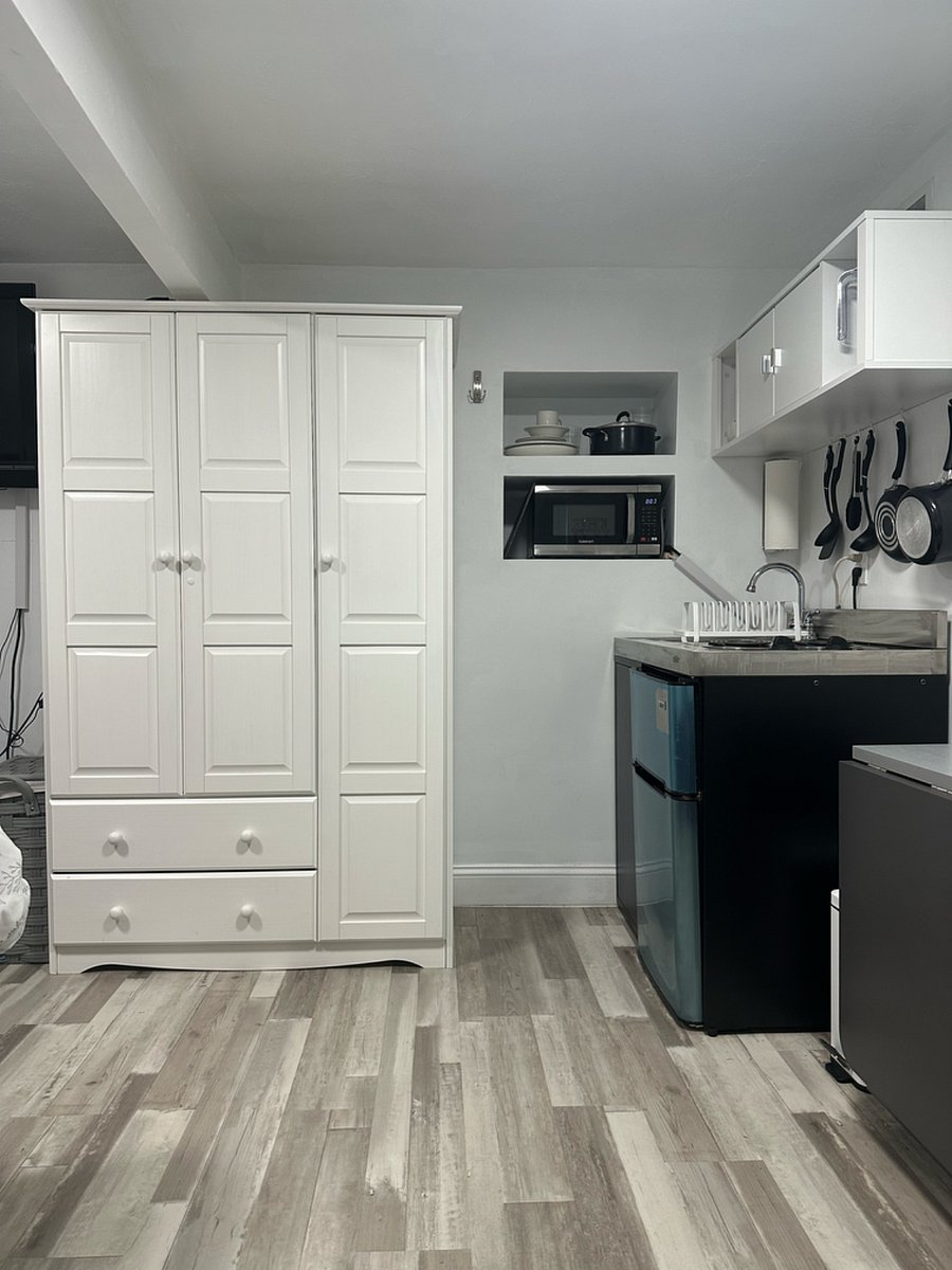 Armoire Closet - Comes Equipped with Hangers, Side Shelves, and Two Drawers.