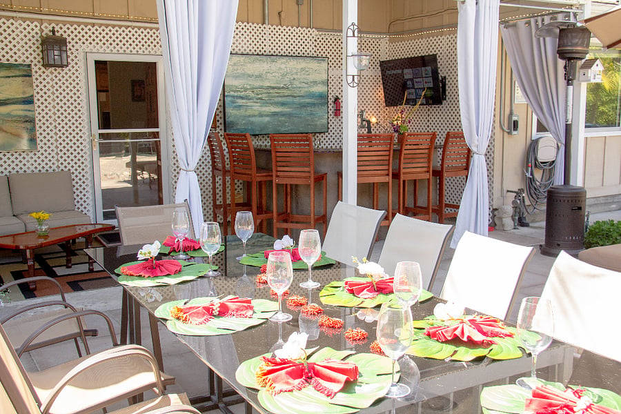 Outdoor dining table for 10, in addition, there is a table for 4.  The bar seats 6 people.