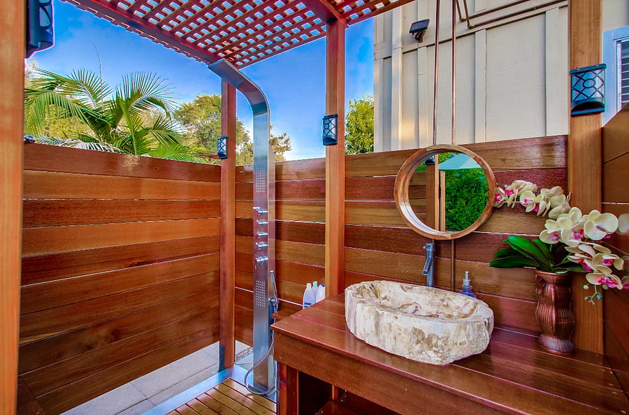 Indulge in the opulent shower experience, featuring a multi-shower head massage and a stunning petrified wood sink. Revel in the utmost privacy as you luxuriate in your shower sanctuary.