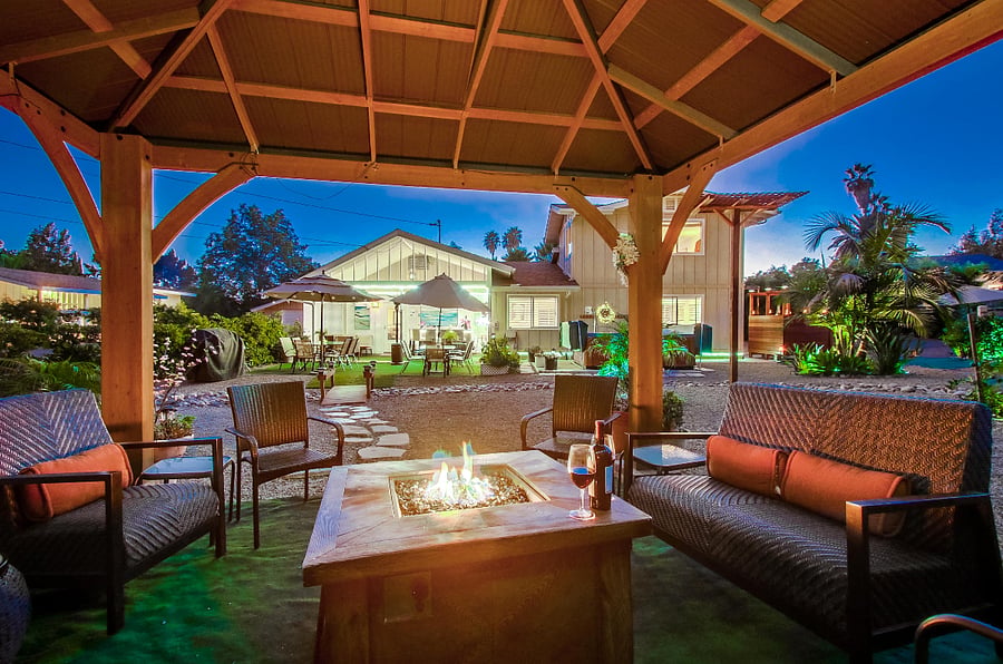 Unwind with a glass of wine in the gazebo, accompanied by the comforting glow of a propane fire-pit.