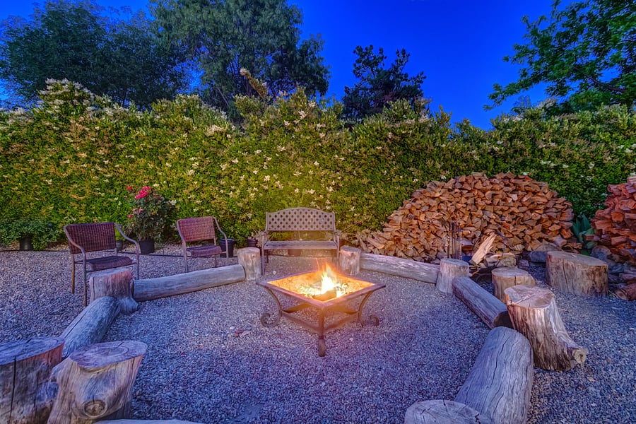 Savor the cozy ambiance of the wood fire pit as you gather with family and friends. Roast marshmallows and craft delectable s'mores for unforgettable moments together.